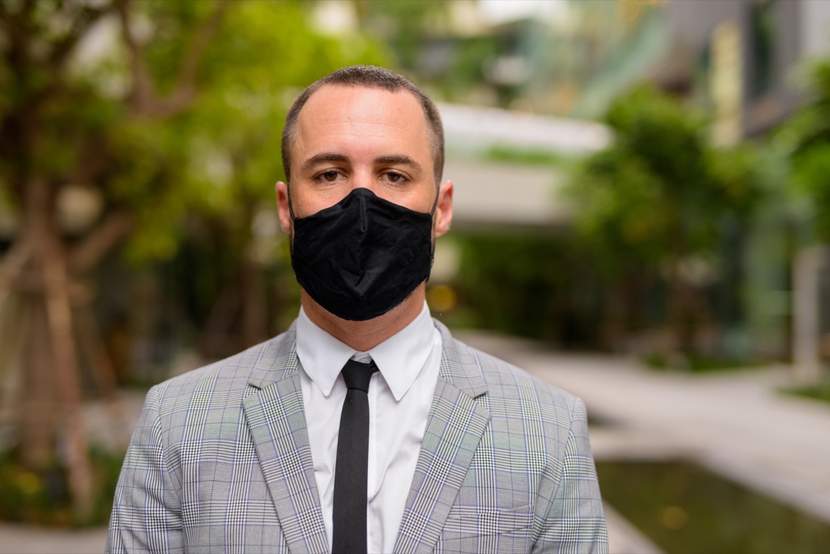 Businessman wearing mask.