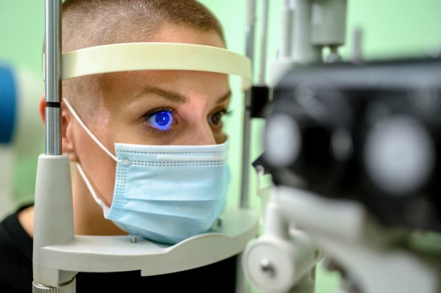Woman having an eye exam at ophthalmologist's office