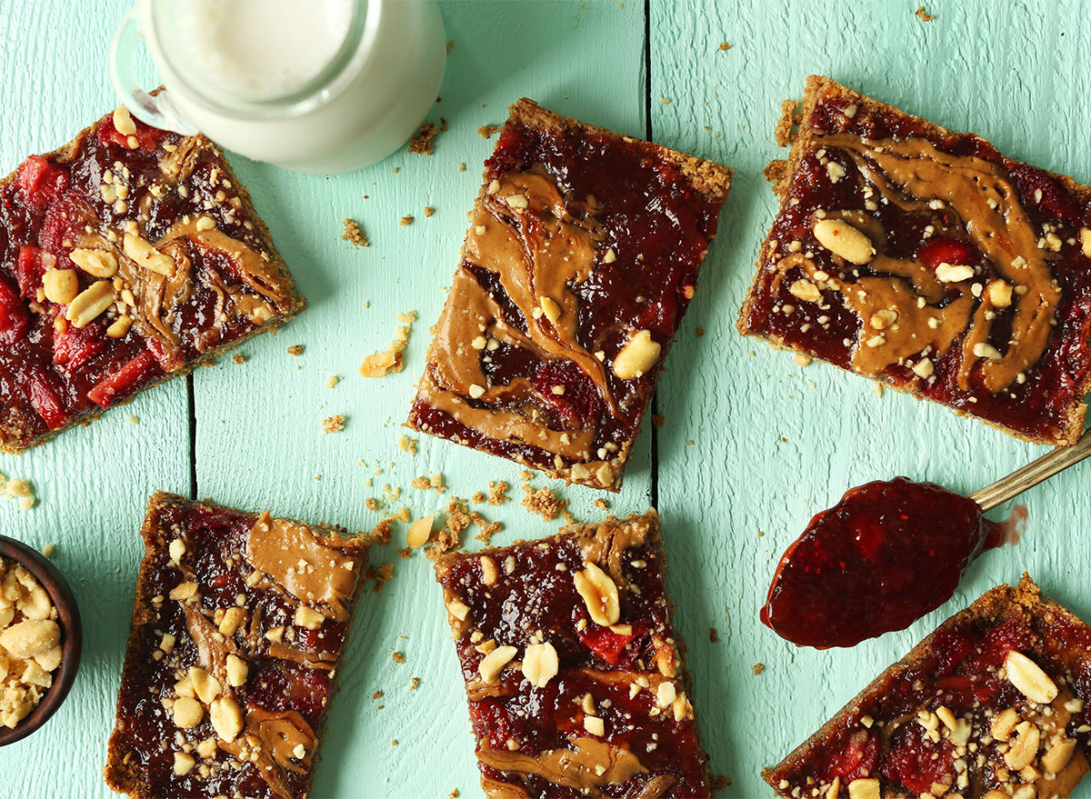 peanut butter and jelly snack bars with glass of milk