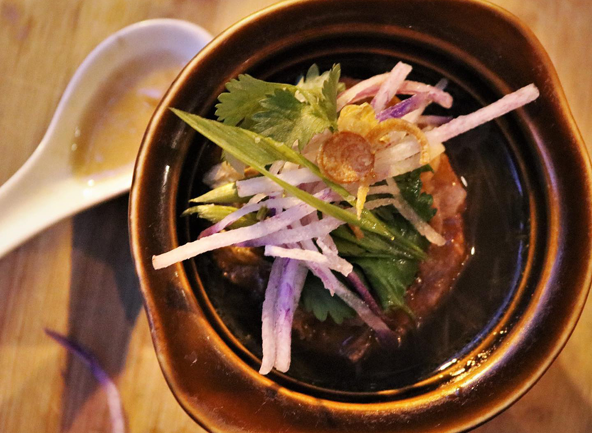 french onion soup topped with fresh vegetables