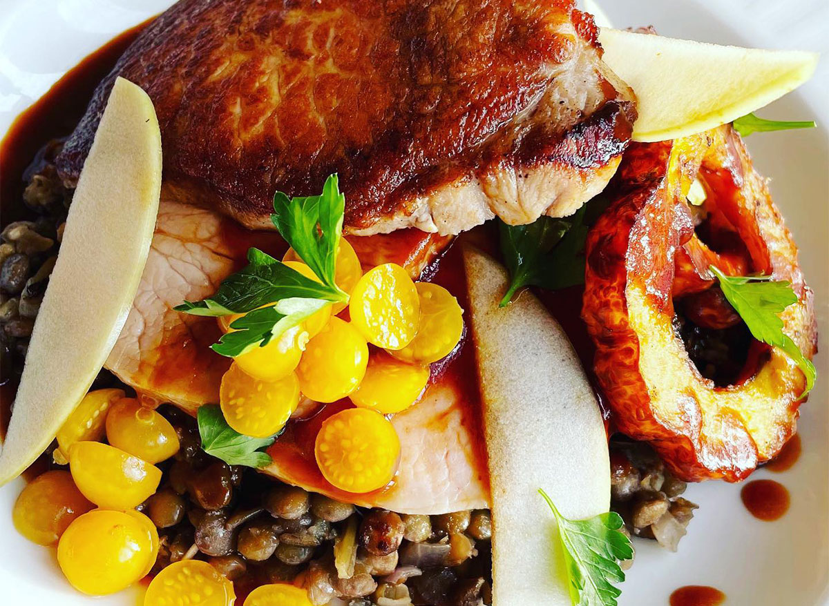 roast pork loin with yellow tomatoes and farro