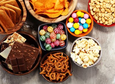 salty and sweet snacks in bowls