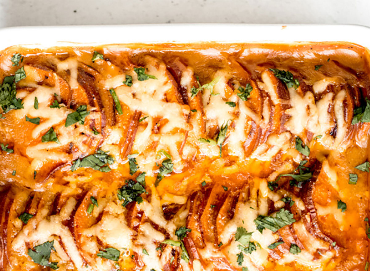 scalloped sweet potatoes in baking dish