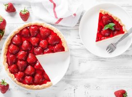 whole strawberry tart with slice