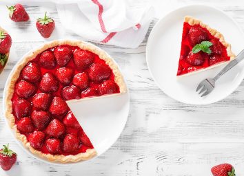 whole strawberry tart with slice