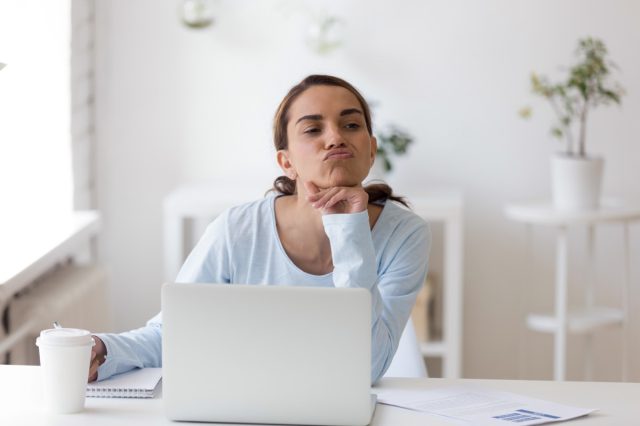 Employee tired to work taking a break making funny face