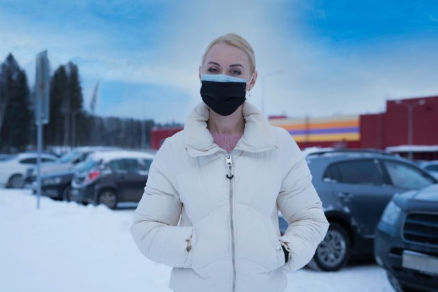 woman wearing two medical masks at the same time.