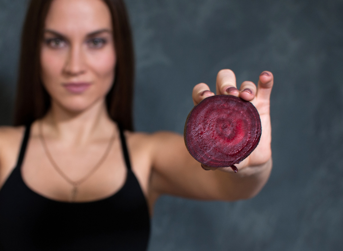 woman holding beet exercise workout performance