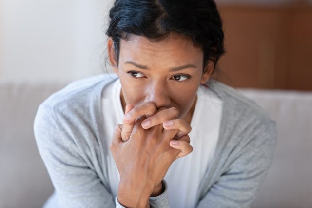 Woman looking into distance.