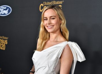 brie larson in white one-shoulder dress on red carpet
