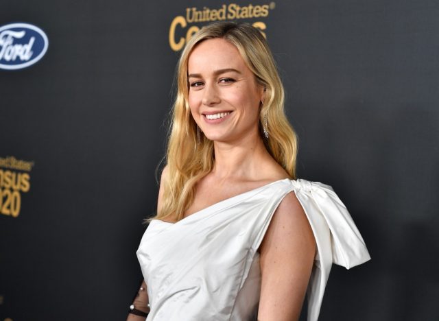brie larson in white one-shoulder dress on red carpet