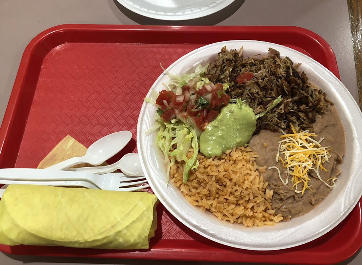 plate of carnitas with rice and beans