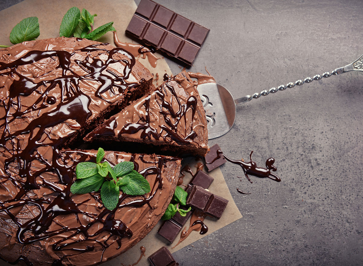 whole chocolate cake garnished with mint leaves