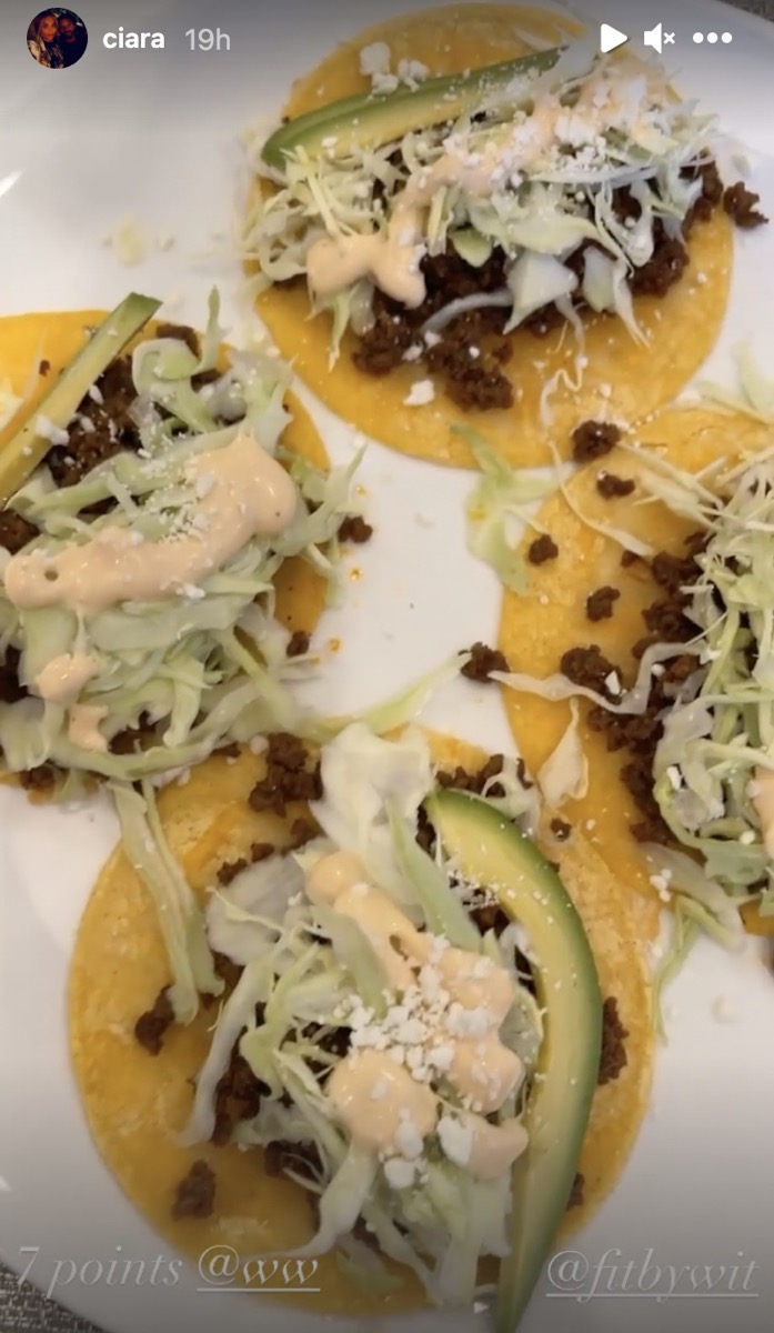 plate of tacos with lettuce and avocado
