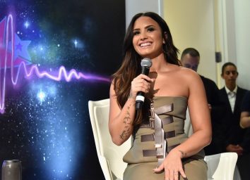 demi lovato during interview in brown or gold dress