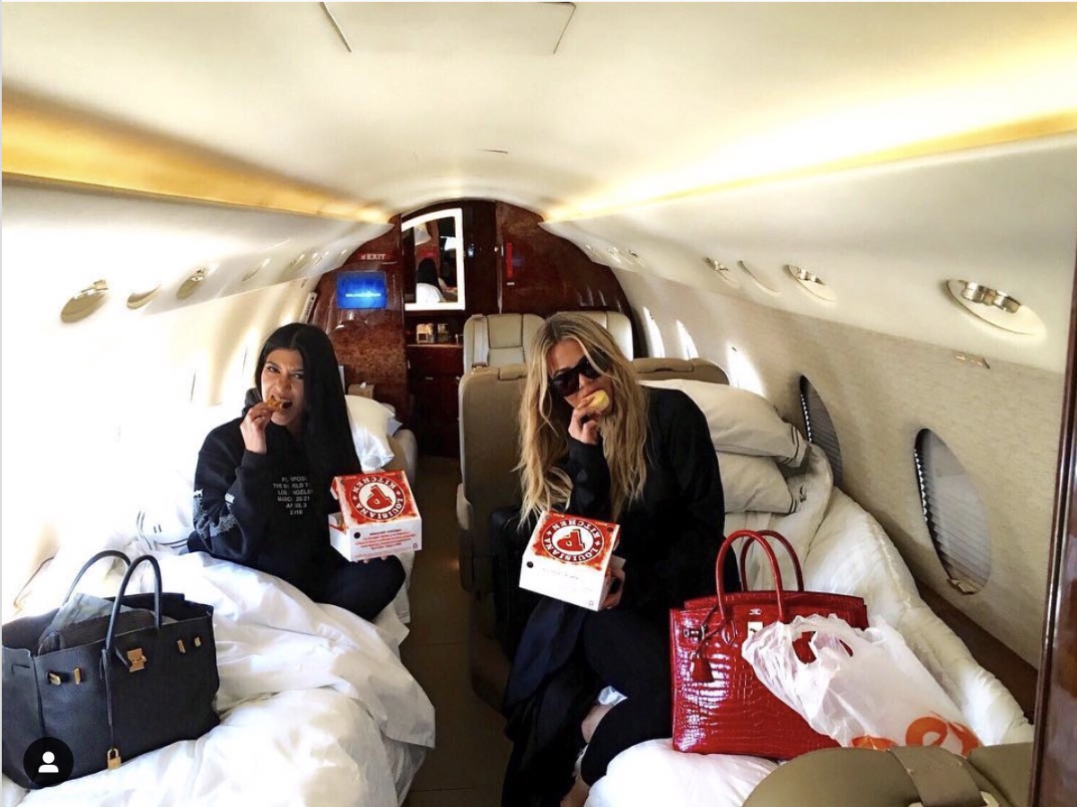 kourtney and khloe kardashian on a private jet