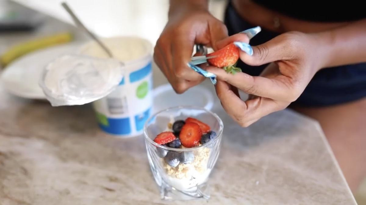 Megan Thee Stallion slicing berries