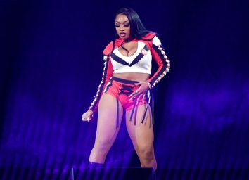 megan thee stallion performing in red and white leather outfit