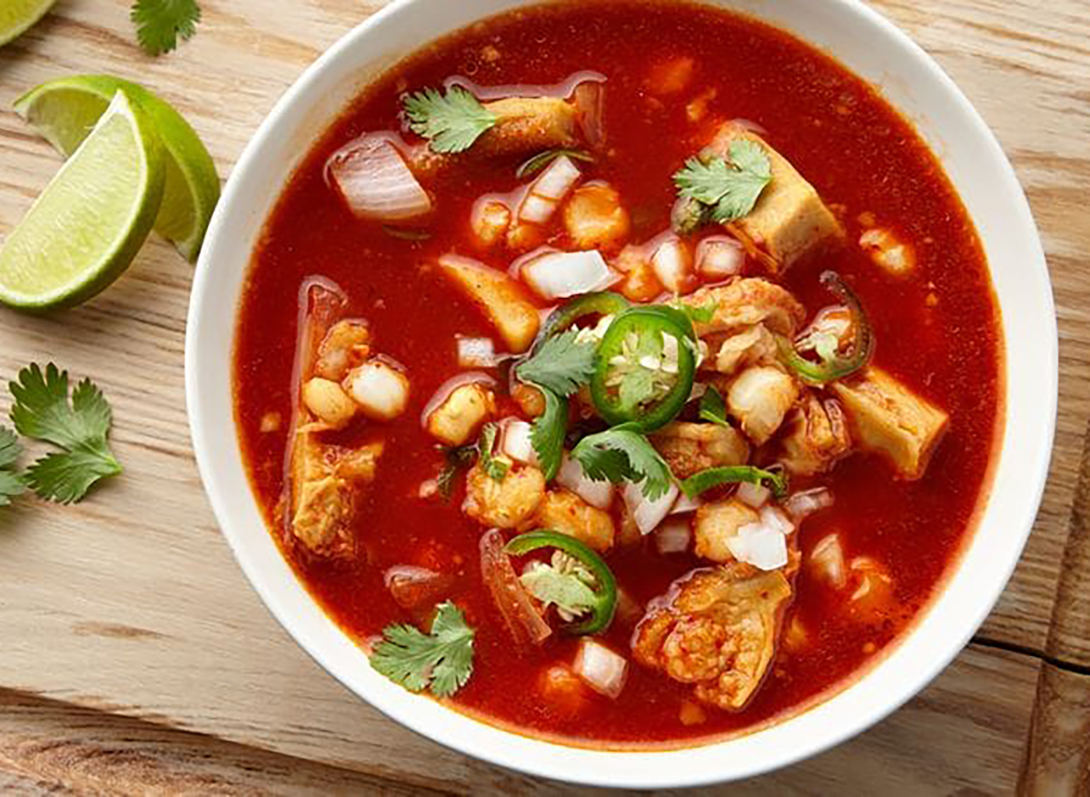 bowl of mexican soup with jalapeno and lime