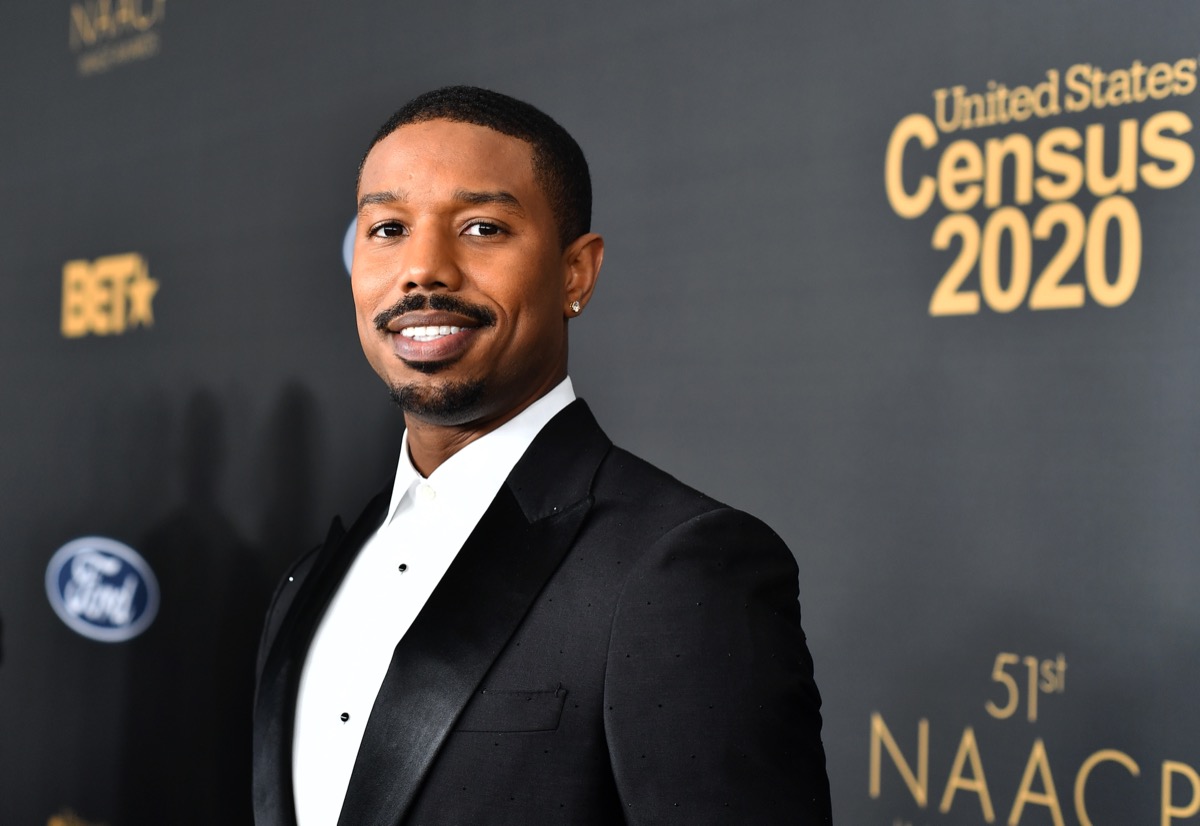 michael b jordan in a suit on the red carpet
