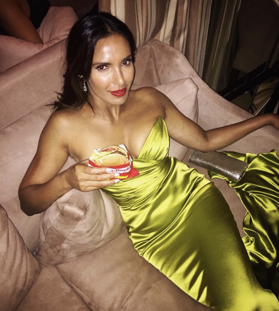 padma lakshmi in green or yellow gown holding in-n-out burger
