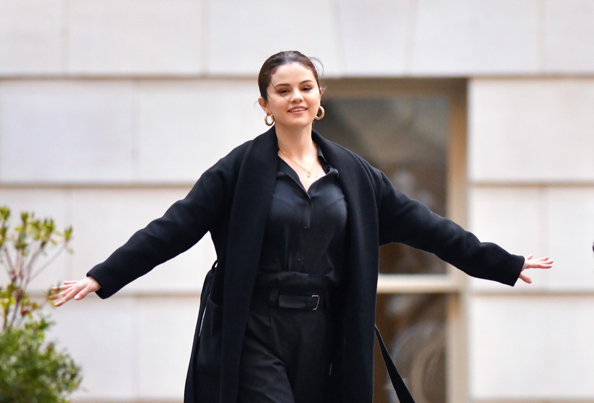selena gomez on new york city street in black outfit