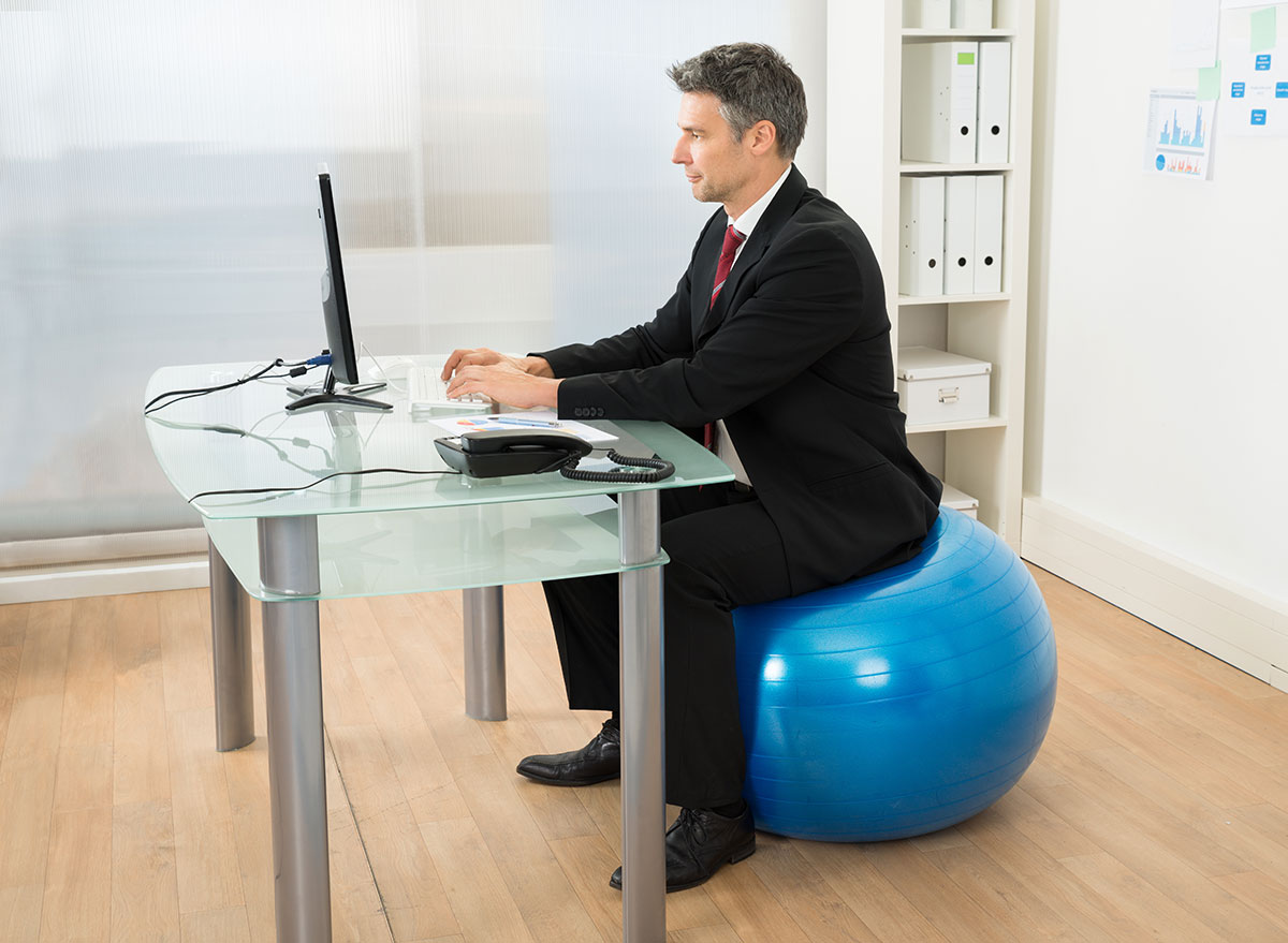 sitting on yoga ball in office