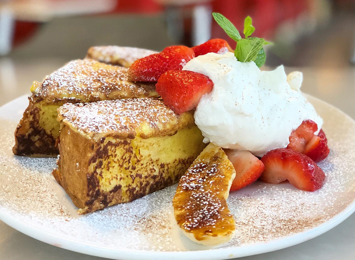 slices of sweet bread french toast with fruit and powdered sugar