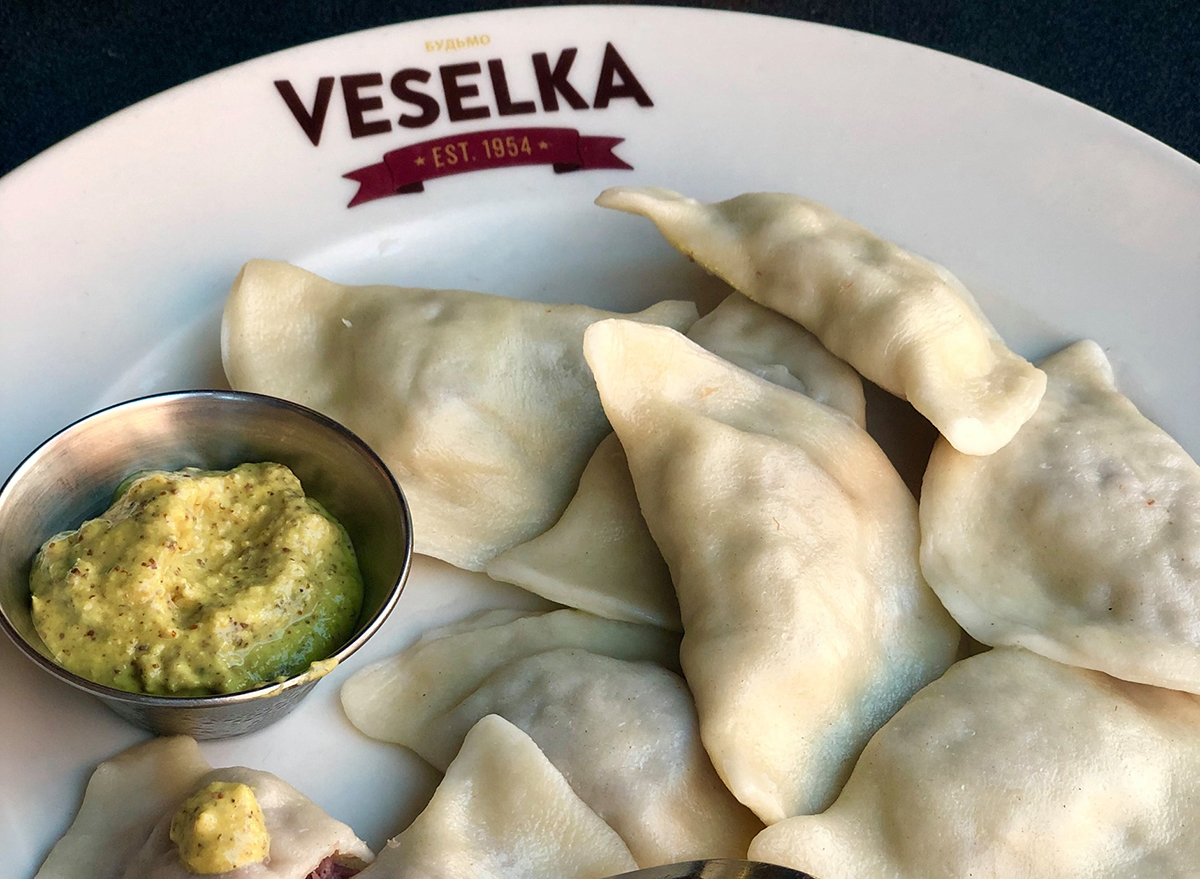 plate of pierogis with mustard