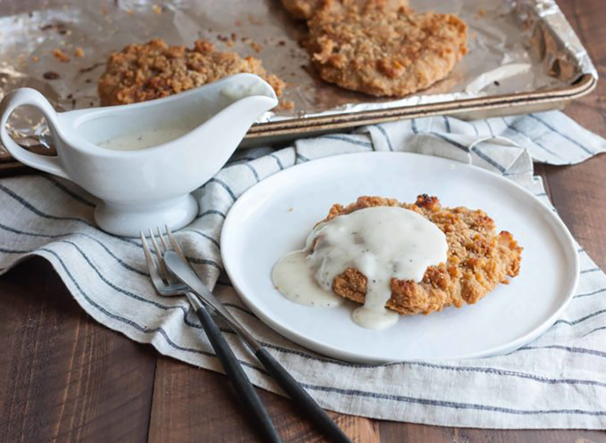 fried chicken topped with white gravy