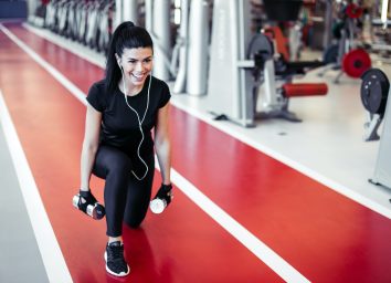 woman at the gym doing squats