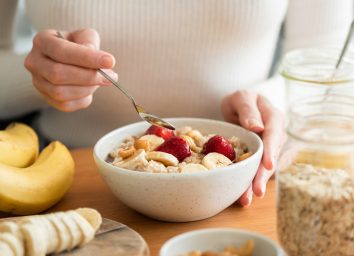 woman eating oatmeal for breakfast