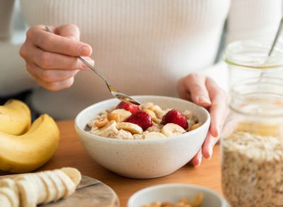 woman eating oatmeal for breakfast