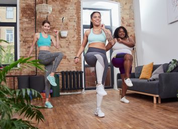 women walking in place at home during a walking workout