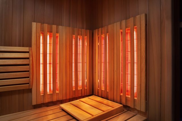 Interior of Finnish sauna, infrared panels for medical procedures, classic wooden sauna