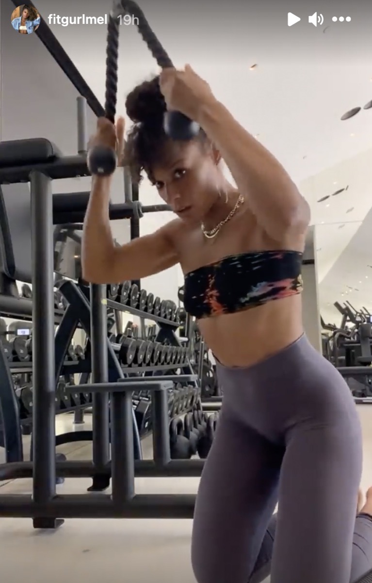 melissa alcantara in bandeau top and gray pants doing a cable crunch