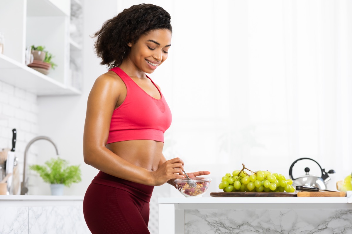 young athletic woman making oatmeal