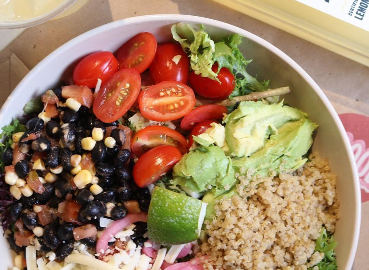 avocado and lime bowl with grains and corn