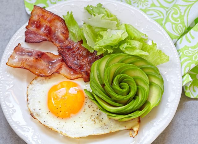 bacon, eggs, and avocado flower on plate