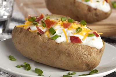 baked potato with chives and sour cream