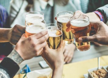 group of friends toasting with glasses of beer