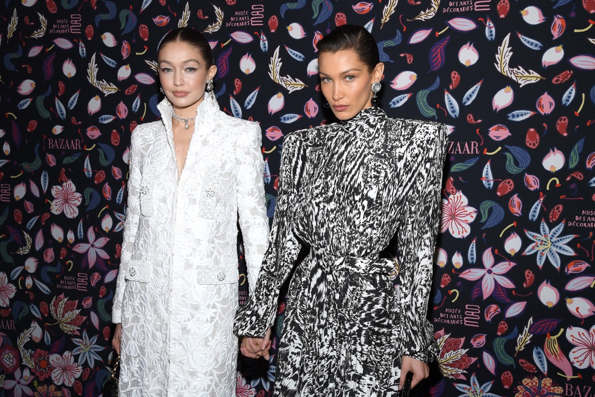 bella hadid and gigi hadid holding hands on red carpet