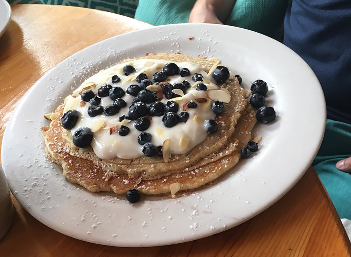 blueberry pancakes topped with yogurt