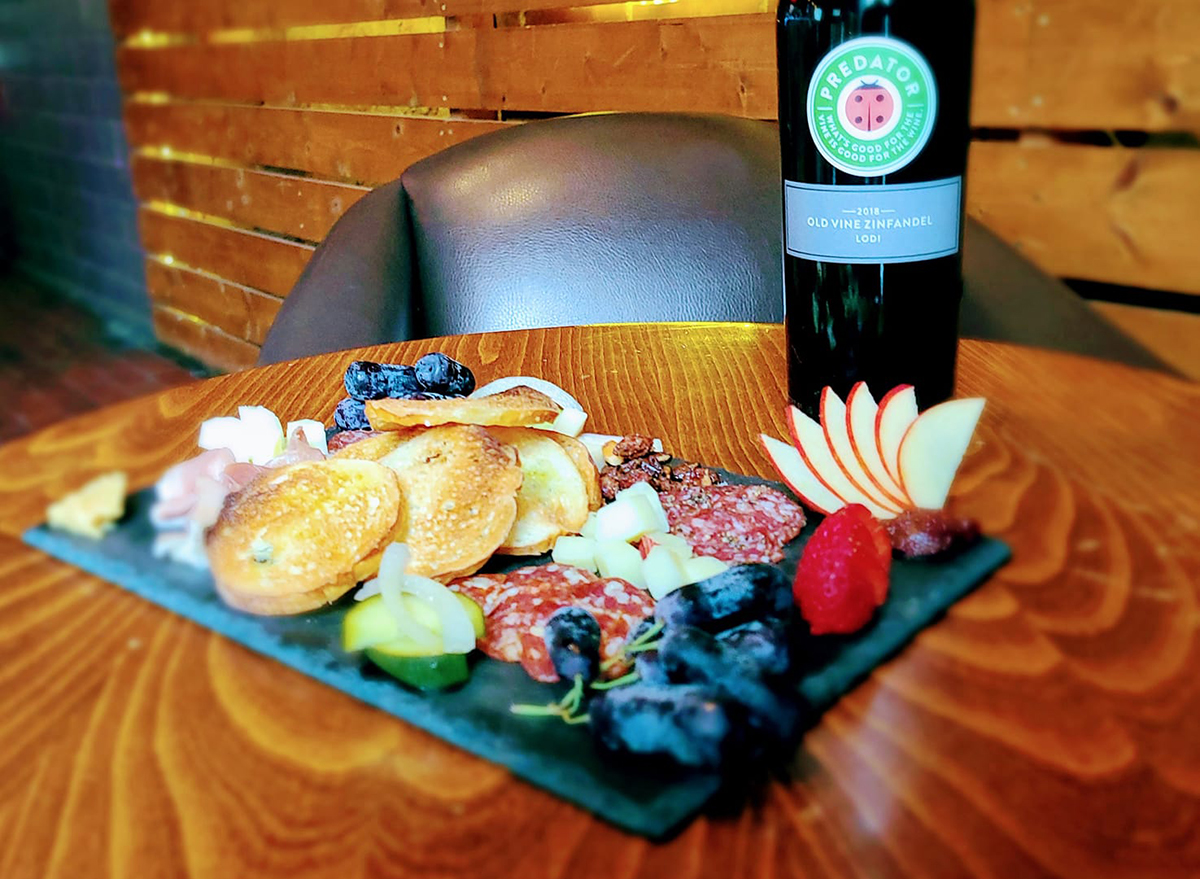 salami and fruit plate with wine bottle