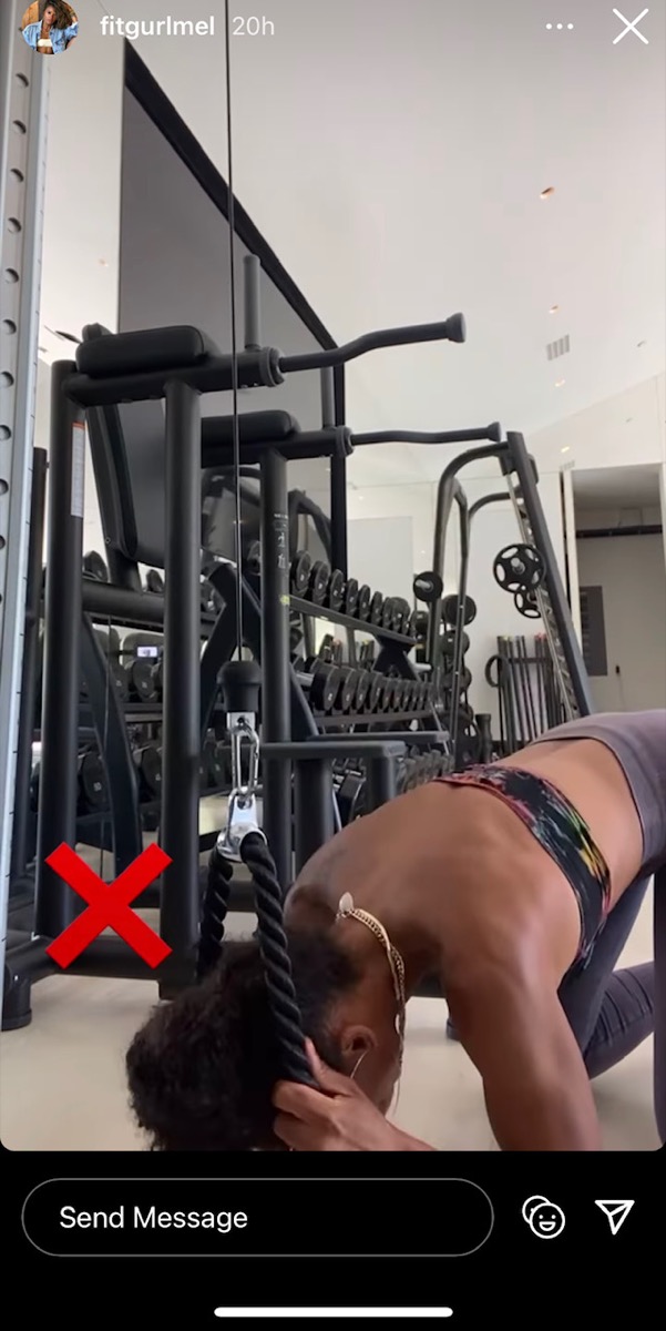 melissa alcantara in bandeau top and gray pants doing a cable crunch ab workout and putting her elbows on the floor