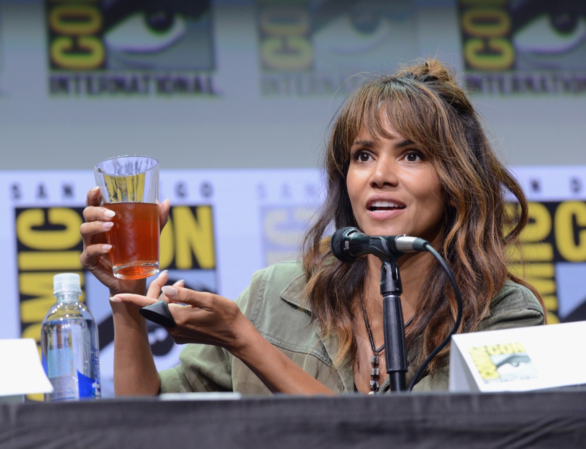 halle berry holding alcoholic drink onstage