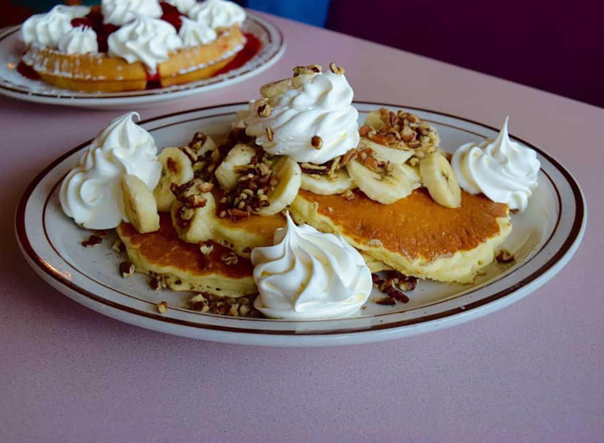 pancakes with whipped cream and chopped nuts