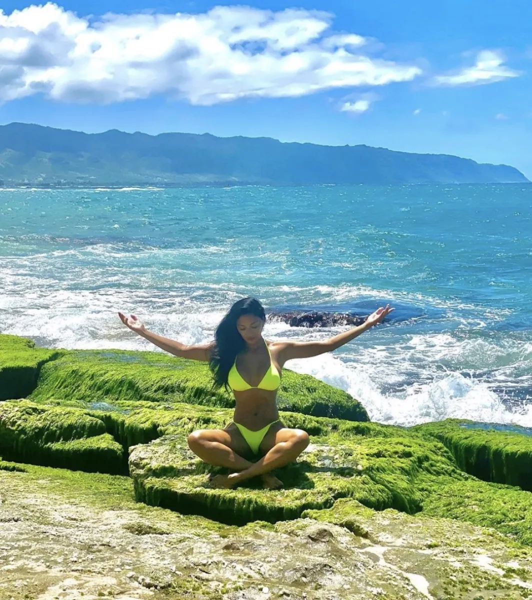 nicole scherzinger stretching in green bikini on beach