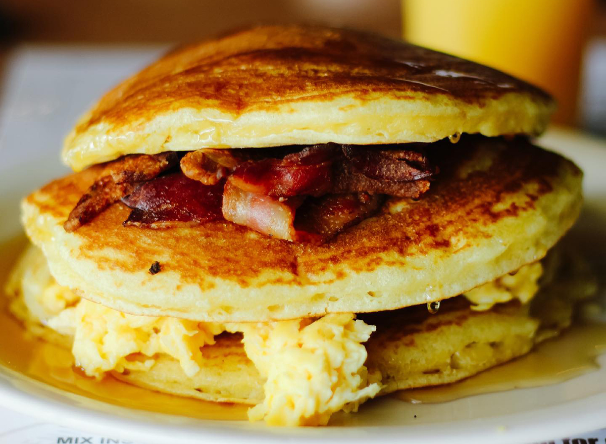 pancake sandwich with eggs and bacon