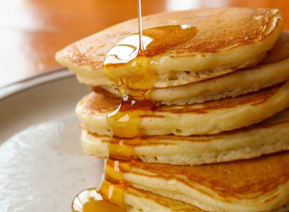 stack of pancakes with syrup drizzle
